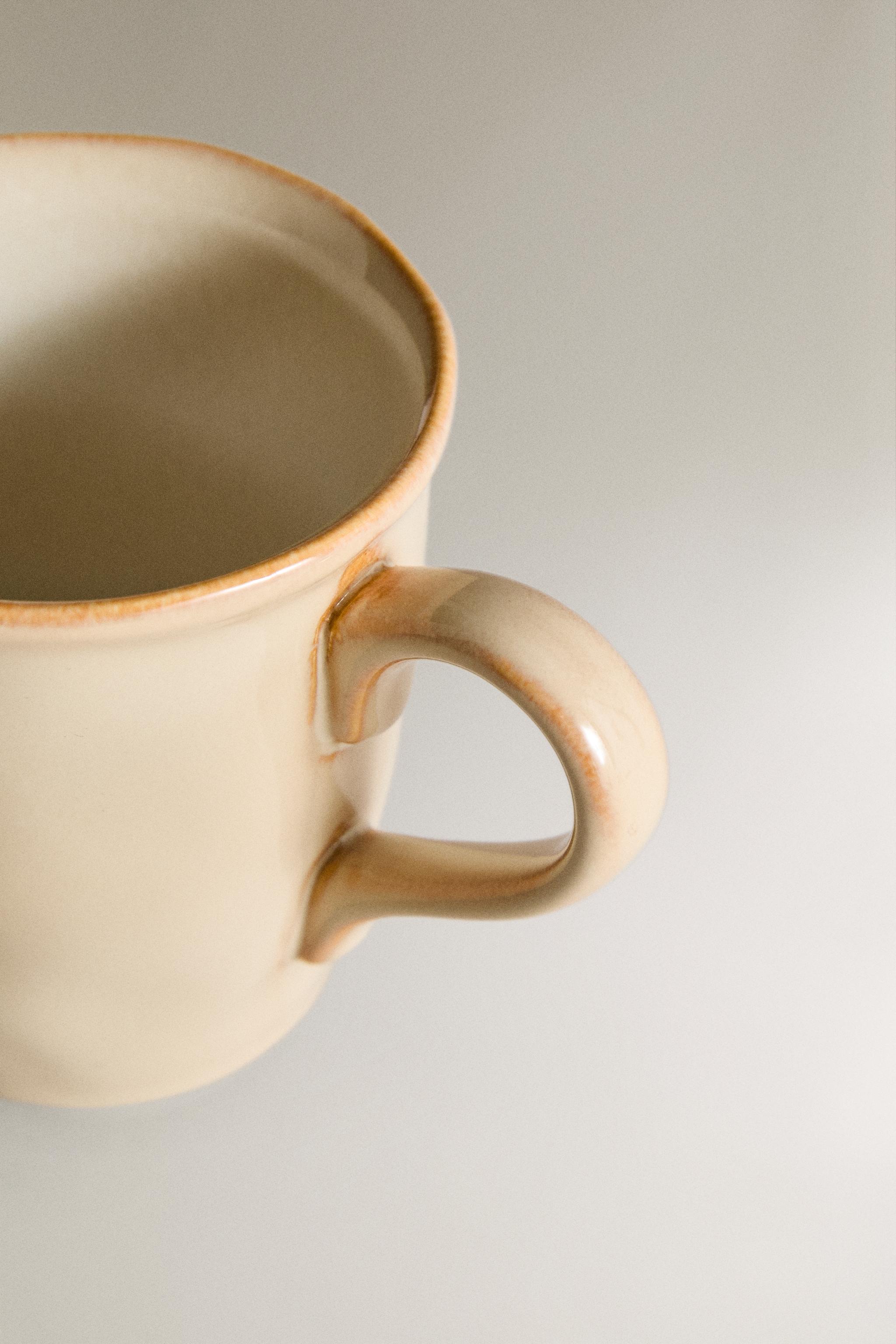 STONEWARE MUG WITH IRREGULAR EDGE